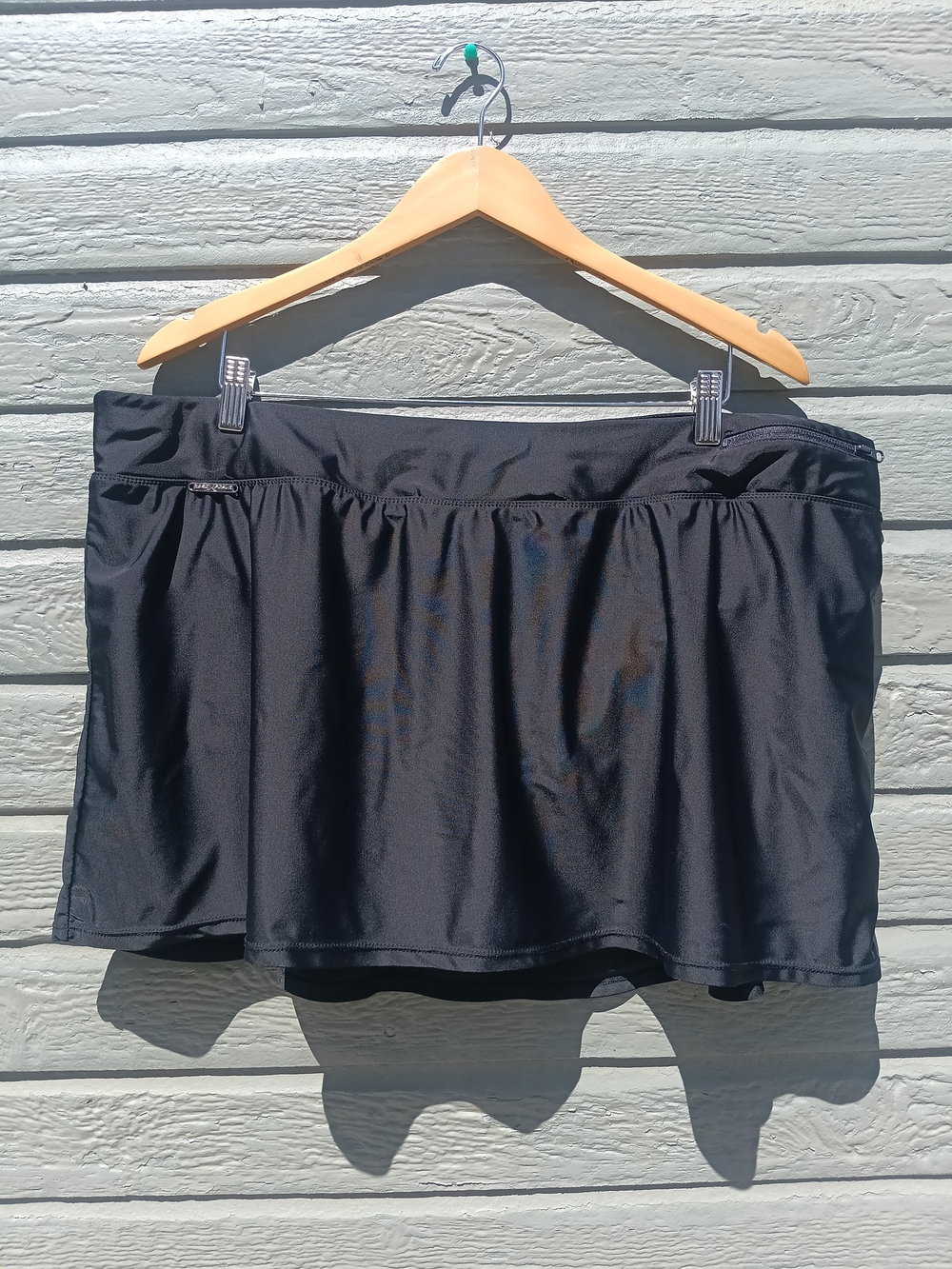 ZeroXposur Black Performance Skort with Silver Logo Plate